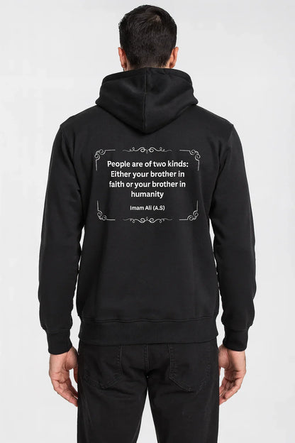 Man wearing black hoodie with faith and humanity quote on back, casual streetwear